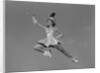 Woman majorette holding baton wearing short skirt uniform jumping into the air by Anonymous