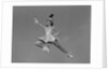 Woman majorette holding baton wearing short skirt uniform jumping into the air by Anonymous