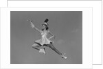 Woman majorette holding baton wearing short skirt uniform jumping into the air by Anonymous
