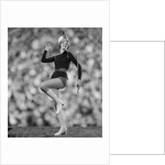 Smiling young woman majorette white boots hot pants marching by Anonymous