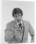 Businessman serious expression pointing with eyeglasses by Anonymous