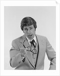 Businessman serious expression pointing with eyeglasses by Anonymous