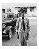 Portrait of old man wearing hat glasses tie & suspenders car in background by Anonymous