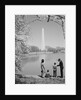 Family mother father two boys in washington dc looking at washington monument amid cherry blossoms by Anonymous