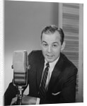 Man speaking into microphone radio tv announcer broadcaster by Anonymous