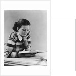 Young brunette woman teen striped sweater reading book studying by Anonymous