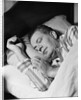 Man asleep sleeping in bed wearing pajamas by Anonymous