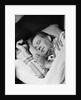 Man asleep sleeping in bed wearing pajamas by Anonymous