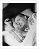 Man asleep sleeping in bed wearing pajamas by Anonymous