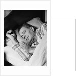 Man asleep sleeping in bed wearing pajamas by Anonymous