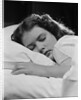 Girl sleeping head on pillow by Anonymous
