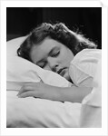 Girl sleeping head on pillow by Anonymous