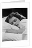 Girl sleeping head on pillow by Anonymous