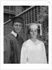 Graduation couple in cap and gown by Anonymous