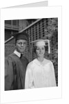 Graduation couple in cap and gown by Anonymous
