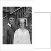 Graduation couple in cap and gown by Anonymous
