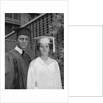 Graduation couple in cap and gown by Anonymous
