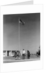 Group 4 school children looking up at american flag by Anonymous