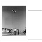 Group 4 school children looking up at american flag by Anonymous