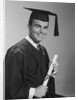 Smiling man holding diploma wearing graduation robes by Anonymous