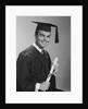Smiling man holding diploma wearing graduation robes by Anonymous