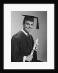 Smiling man holding diploma wearing graduation robes by Anonymous