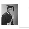 Smiling man holding diploma wearing graduation robes by Anonymous