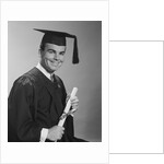 Smiling man holding diploma wearing graduation robes by Anonymous