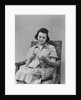 Brunette woman knitting sitting in armchair by Anonymous