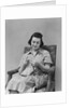 Brunette woman knitting sitting in armchair by Anonymous