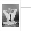 Smiling man working on family budget papers at desk by Anonymous