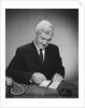 Man writing check from checkbook by Anonymous