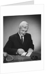 Man writing check from checkbook by Anonymous
