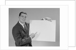 Smiling man pointing to blank poster by Anonymous