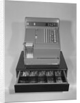 Cash register with money in the open till drawer by Anonymous