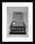 Cash register with money in the open till drawer by Anonymous