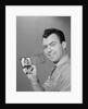 Smiling man holding up wallet with picture of wife and daughter by Anonymous
