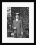 Portrait businessman wearing hat suit holding briefcase by Anonymous