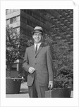 Portrait businessman wearing hat suit holding briefcase by Anonymous