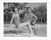 Man woman couple sitting on diving board on side of swimming pool by Anonymous