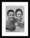 Smiling couple man woman in swimming pool by Anonymous
