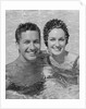 Smiling couple man woman in swimming pool by Anonymous