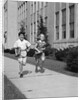 Boy girl running down sidewalk carrying school books smiling by Anonymous