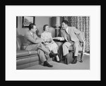 Couple sitting on couch talking to smiling insurance salesman handing them a policy by Anonymous
