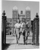 College aged student couple walking through campus gates university of pennsylvania by Anonymous