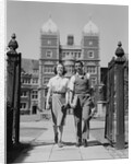 College aged student couple walking through campus gates university of pennsylvania by Anonymous