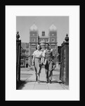 College aged student couple walking through campus gates university of pennsylvania by Anonymous