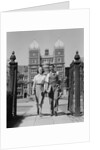 College aged student couple walking through campus gates university of pennsylvania by Anonymous