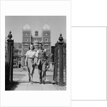 College aged student couple walking through campus gates university of pennsylvania by Anonymous