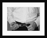 Man hands tightening belt by Anonymous